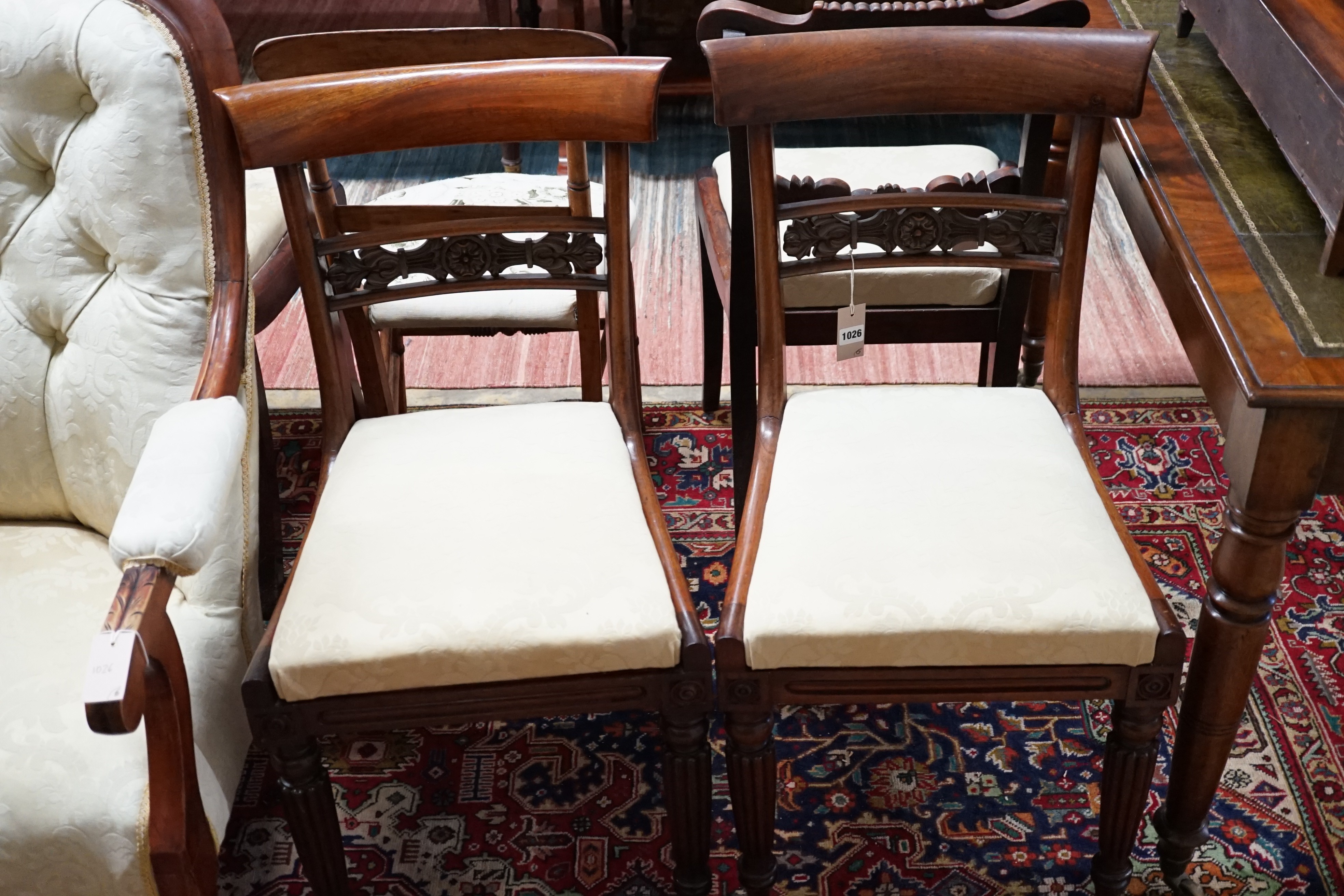 Two pairs of William IV mahogany dining chairs, a Victorian mahogany armchair and a bedroom chair